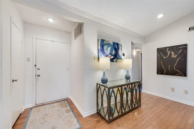 a view of entryway with wooden floor