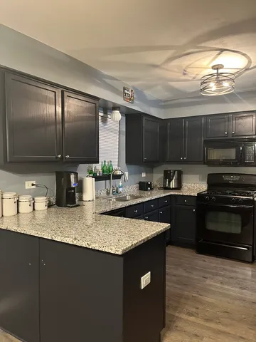 a kitchen with counter top space cabinets and stainless steel appliances