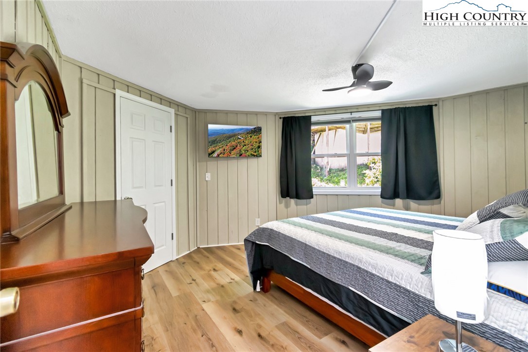 104 Hornbeam Road Beech Mountain, NC 28604 - Photo 14 of 40 a bedroom with a bed and a window