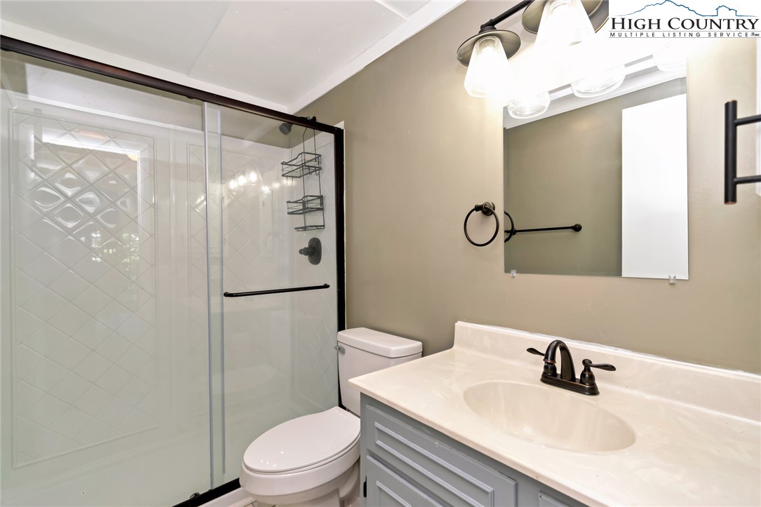104 Hornbeam Road Beech Mountain, NC 28604 - Photo 15 of 40 a bathroom with a sink toilet and shower