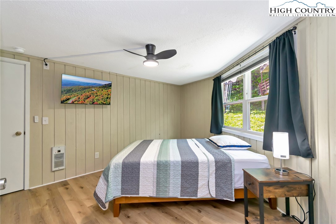 104 Hornbeam Road Beech Mountain, NC 28604 - Photo 17 of 40 a bedroom with a bed and a window