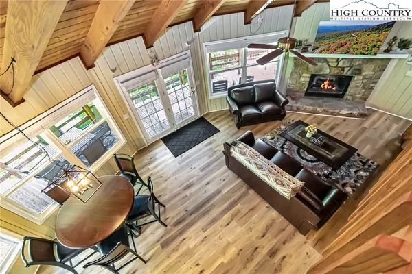 a living room with furniture a fireplace and a table