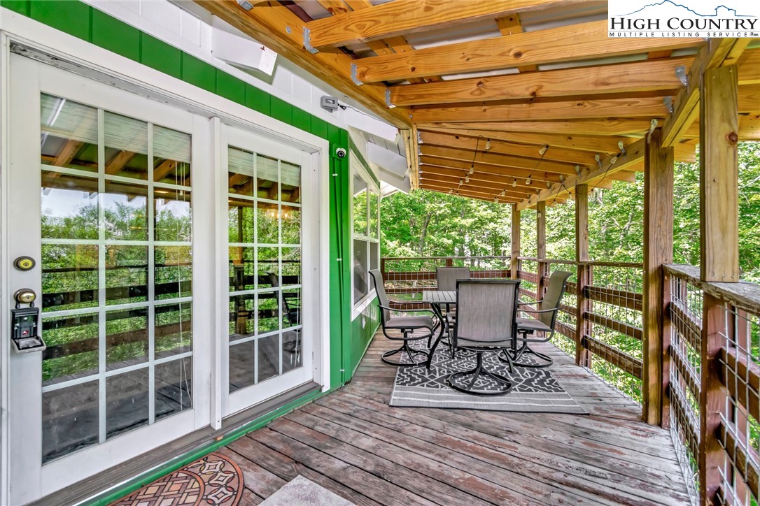 104 Hornbeam Road Beech Mountain, NC 28604 - Photo 24 of 40 a view of a chairs and table in a patio