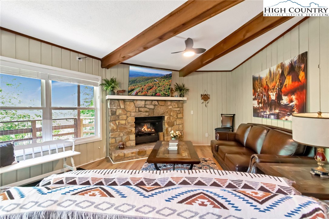 104 Hornbeam Road Beech Mountain, NC 28604 - Photo 27 of 40 a bedroom with a bed and a couch