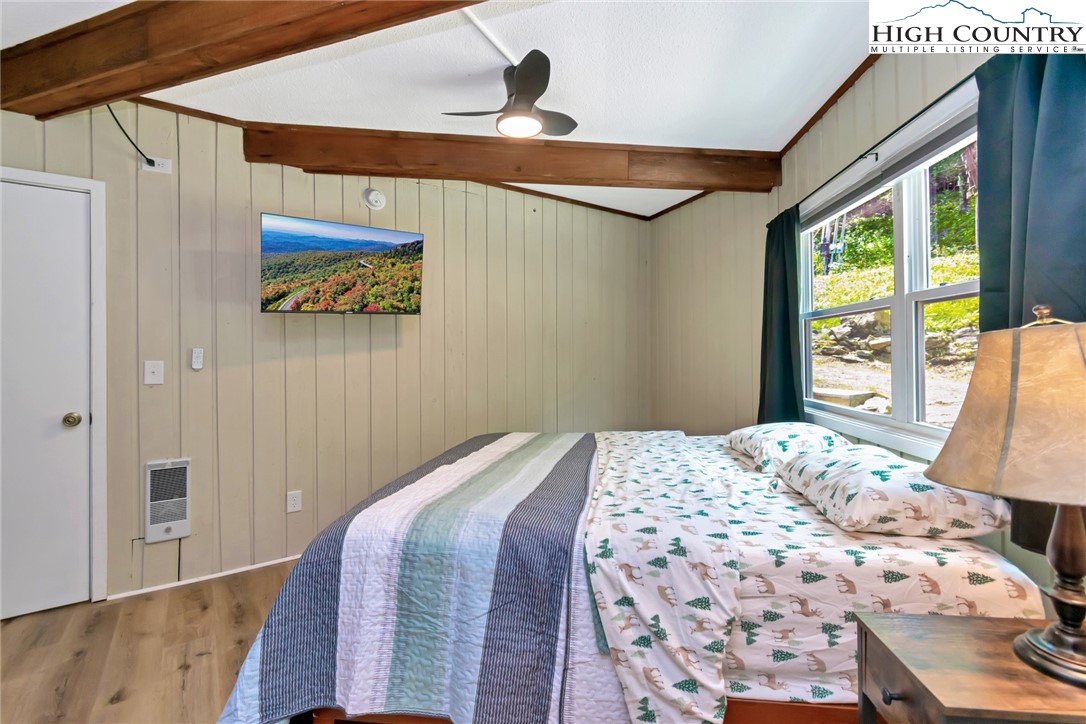 104 Hornbeam Road Beech Mountain, NC 28604 - Photo 30 of 40 a bedroom with a bed and a window