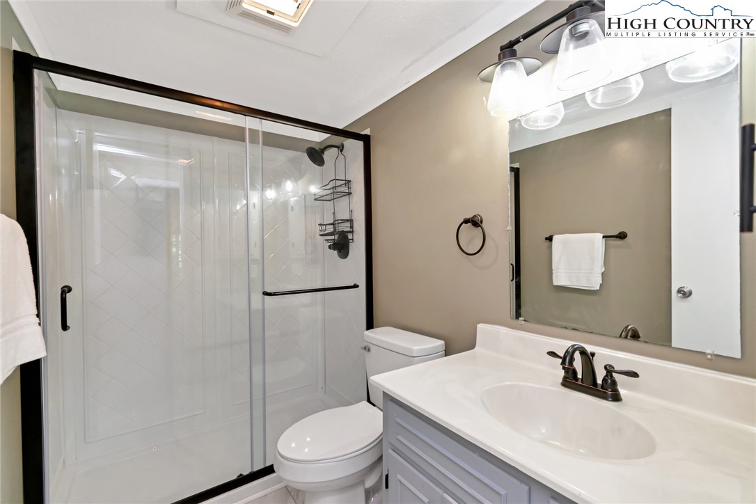 104 Hornbeam Road Beech Mountain, NC 28604 - Photo 32 of 40 a bathroom with a sink toilet and shower