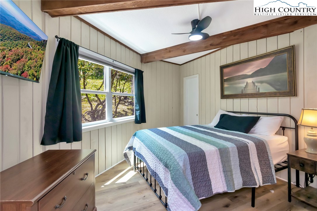 104 Hornbeam Road Beech Mountain, NC 28604 - Photo 35 of 40 a bedroom with a bed and a window