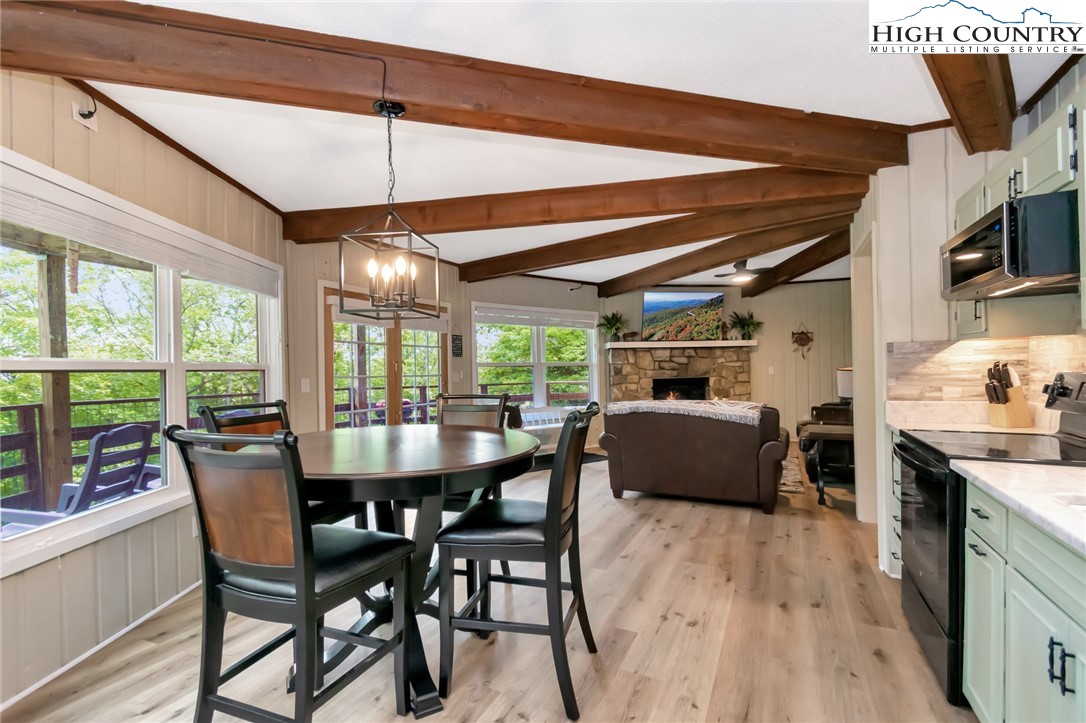 104 Hornbeam Road Beech Mountain, NC 28604 - Photo 40 of 40 a dining room with furniture window wooden floor