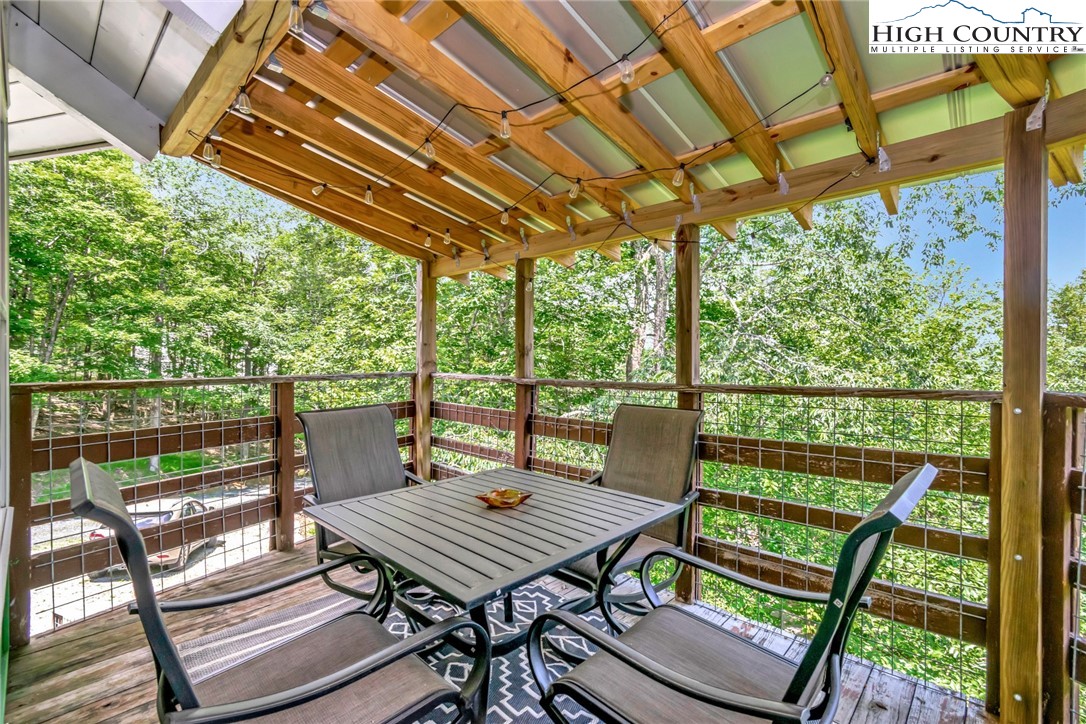 104 Hornbeam Road Beech Mountain, NC 28604 - Photo 10 of 40 a view of a patio with wooden floor