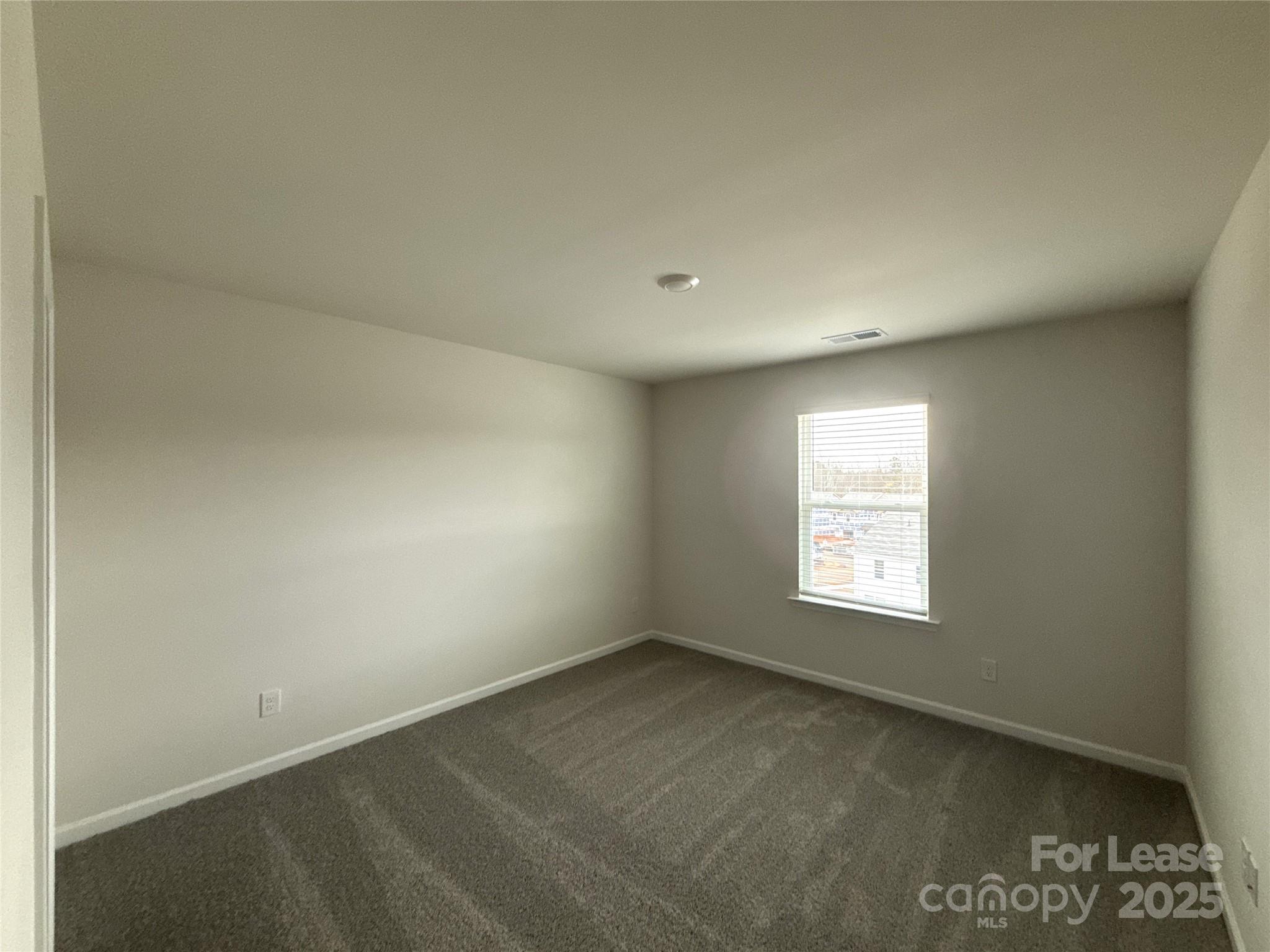 4148 Lurelin Road Charlotte, NC 28262 - Photo 6 of 12 an empty room with a window