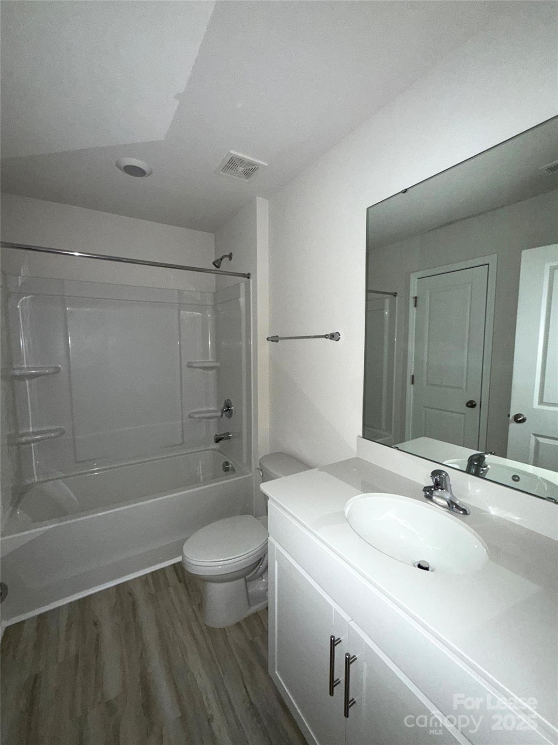 4148 Lurelin Road Charlotte, NC 28262 - Photo 10 of 12 a bathroom with a sink a toilet and shower