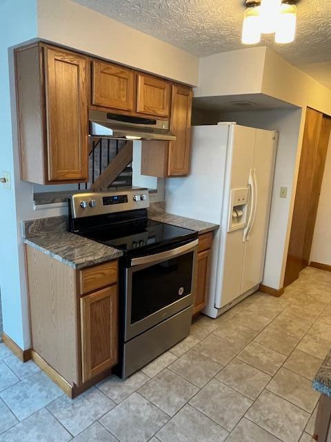 707 Cherry Hollow Road, Unit C Columbus, OH 43228 - Photo 5 of 21 View of ceramic tile floors electric range, side by side refrigerator.