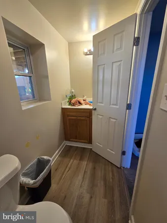 a view of front door with wooden floor