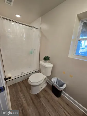 a bedroom with a bed and a table