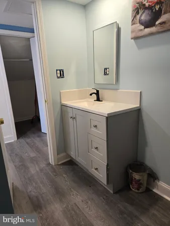 a bedroom with furniture and a tv