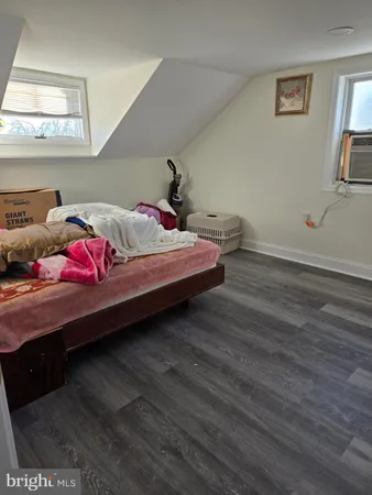 a bedroom with two beds and a couch