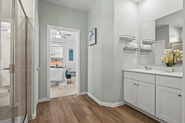 a bathroom with a sink and mirror