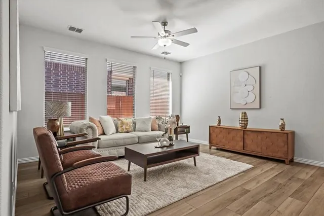 a living room with furniture and windows