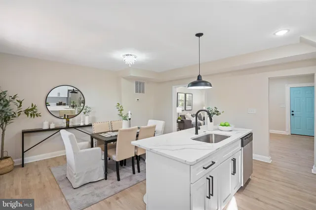 a very nice looking dining room with a table and chairs