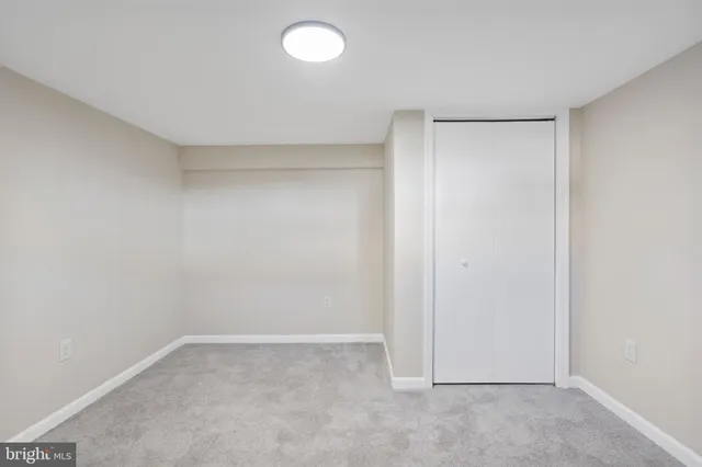 a bathroom with a shower and a sink