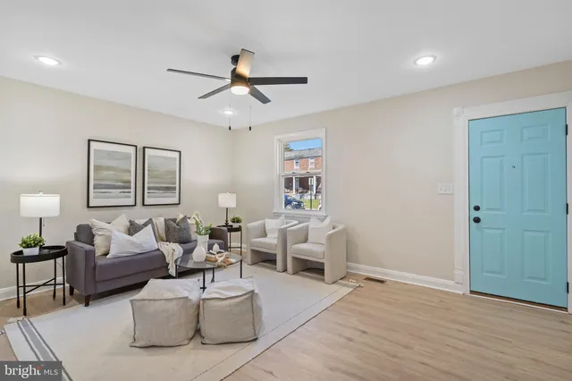 a living room with furniture and a window