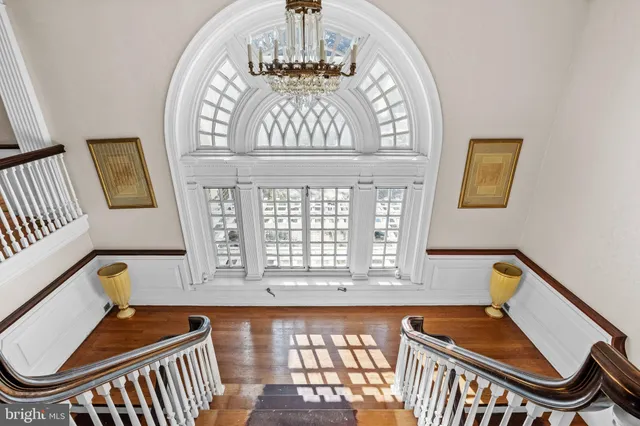 a view of an entryway with wooden floor