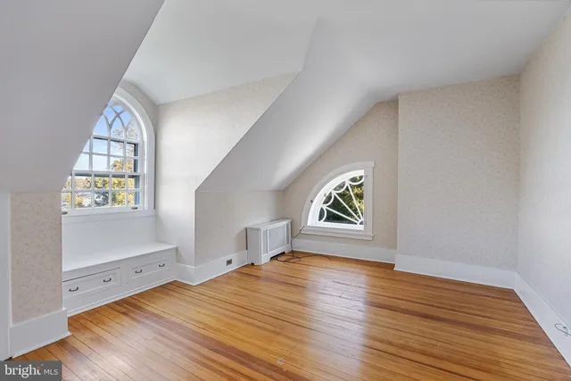 an aerial view of a house with a yard basket ball court and outdoor seating