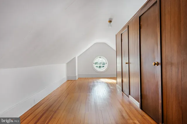 an aerial view of a house with garden space and street view