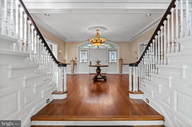 a large kitchen with a table and chairs