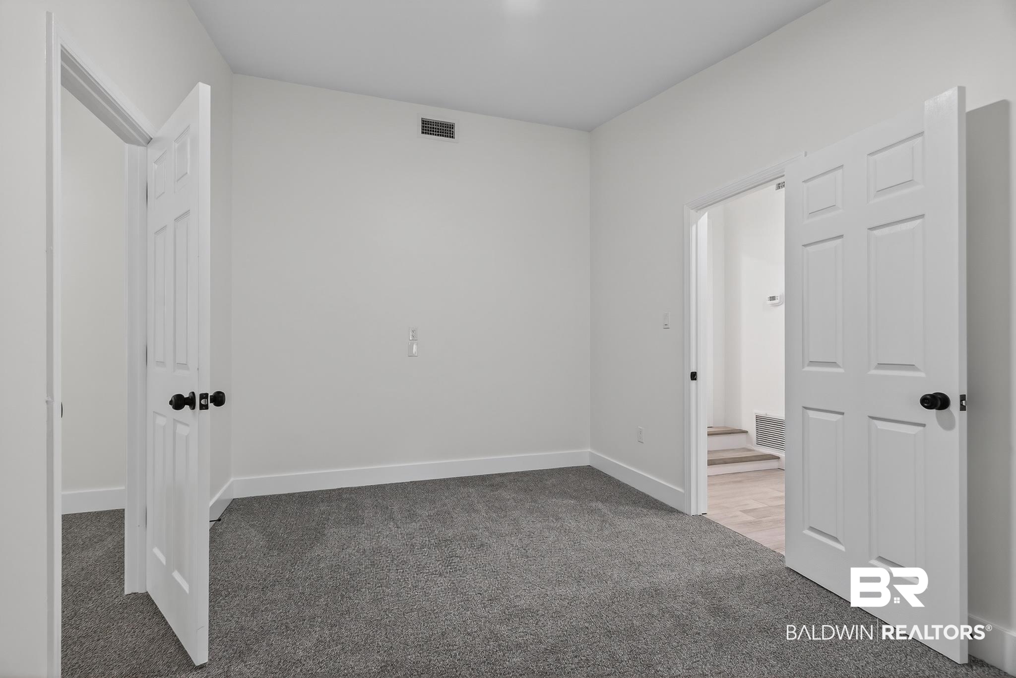 10650 Old Pascagoula Road Theodore, AL 36582 - Photo 59 of 77 Unfurnished bedroom featuring light carpet and baseboards