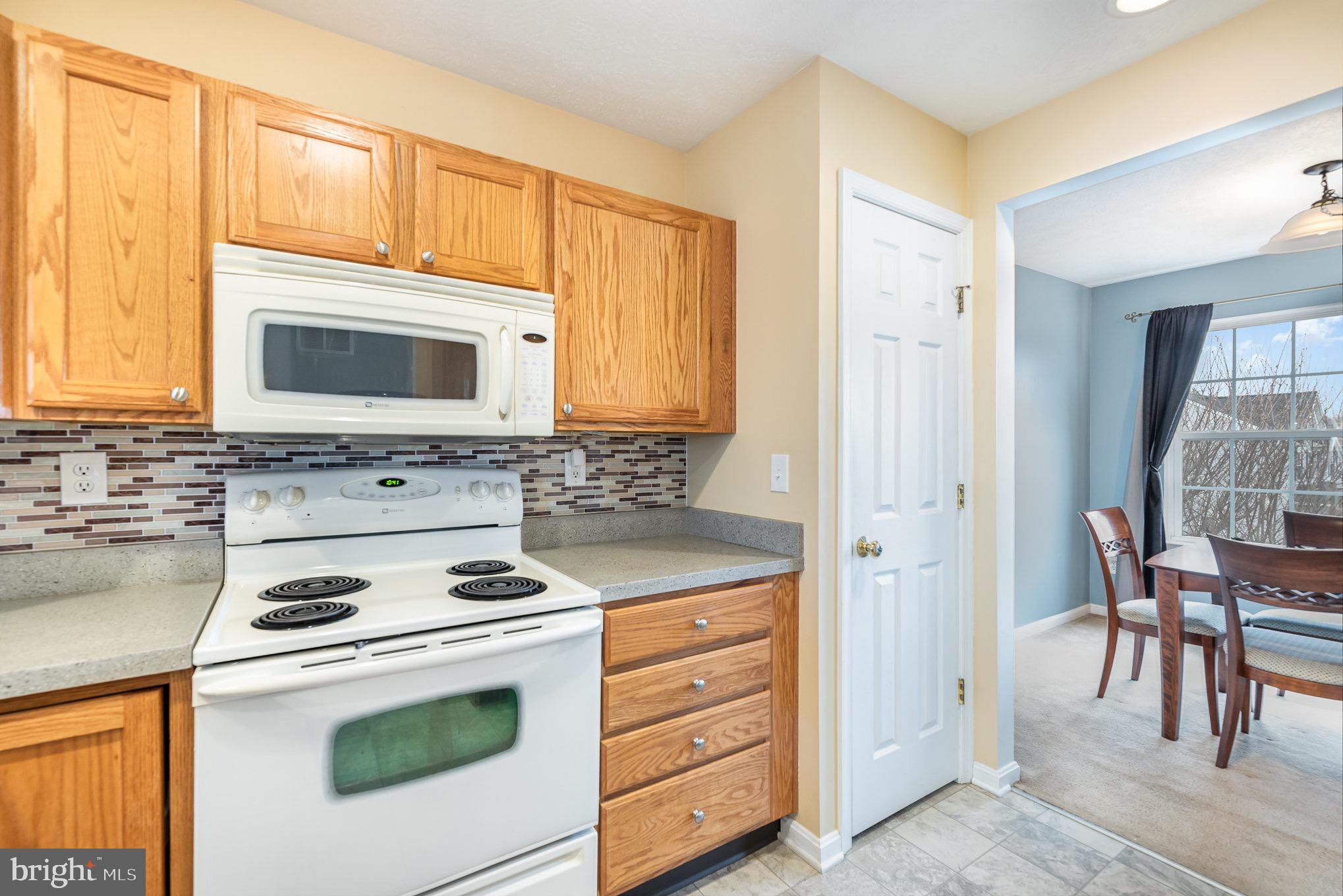 118 Maple Leaf Drive Rising Sun, MD 21911 - Photo 12 of 29 a kitchen with cabinets stainless steel appliances and wooden floor