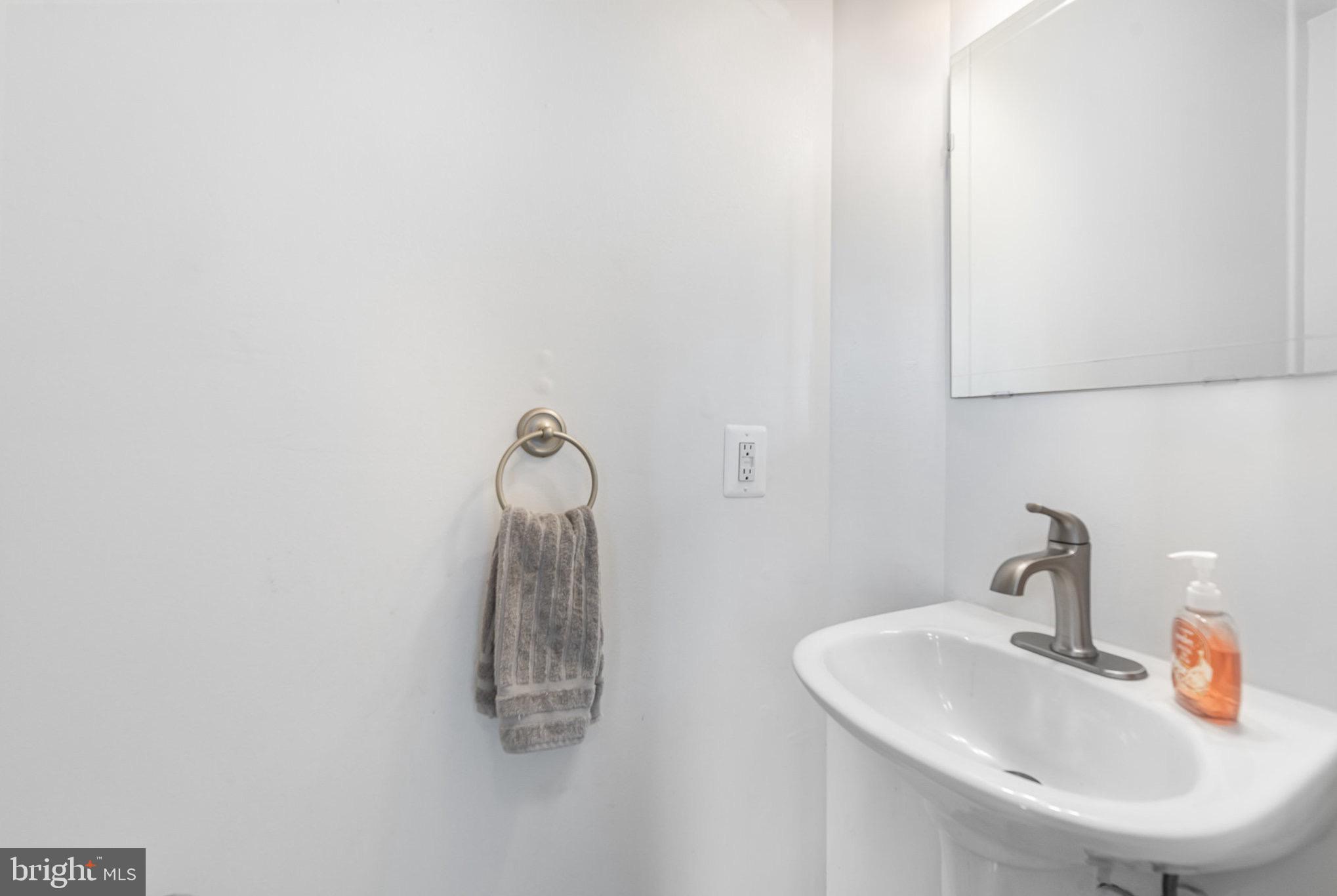 118 Maple Leaf Drive Rising Sun, MD 21911 - Photo 14 of 29 a bathroom with a sink and mirror