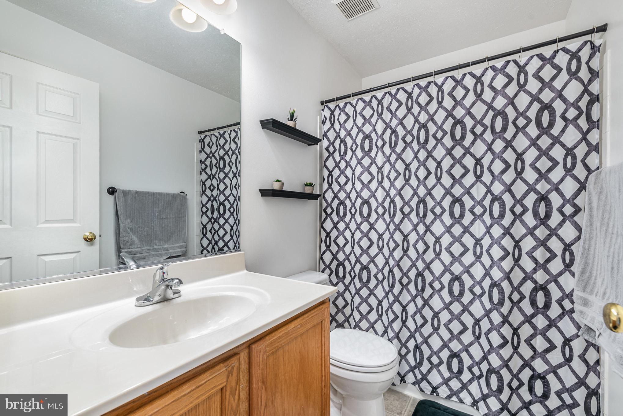 118 Maple Leaf Drive Rising Sun, MD 21911 - Photo 19 of 29 a bathroom with a sink and a toilet
