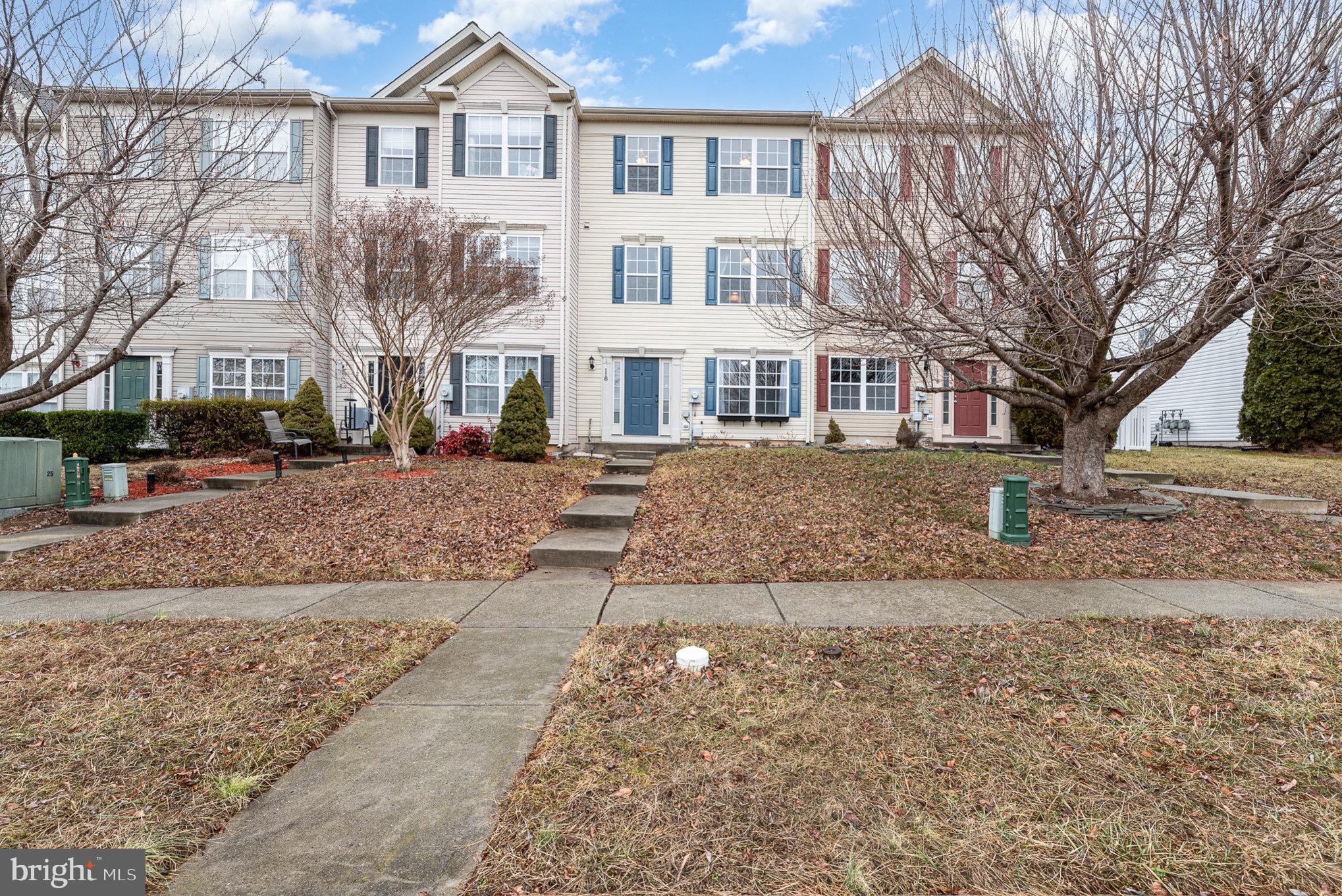 118 Maple Leaf Drive Rising Sun, MD 21911 - Photo 2 of 29 a front view of a house with a yard covered in snow