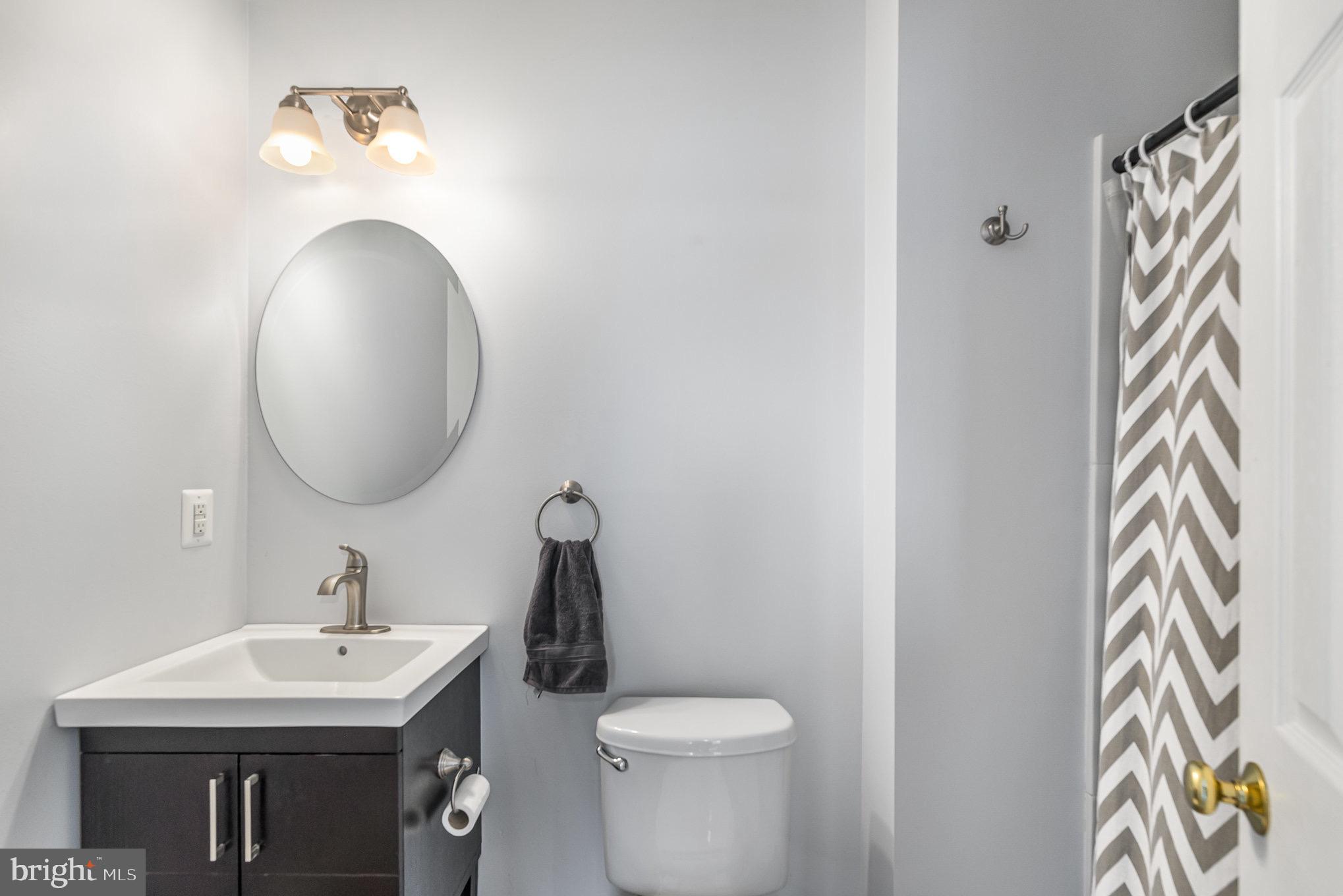 118 Maple Leaf Drive Rising Sun, MD 21911 - Photo 24 of 29 a bathroom with a toilet sink and mirror