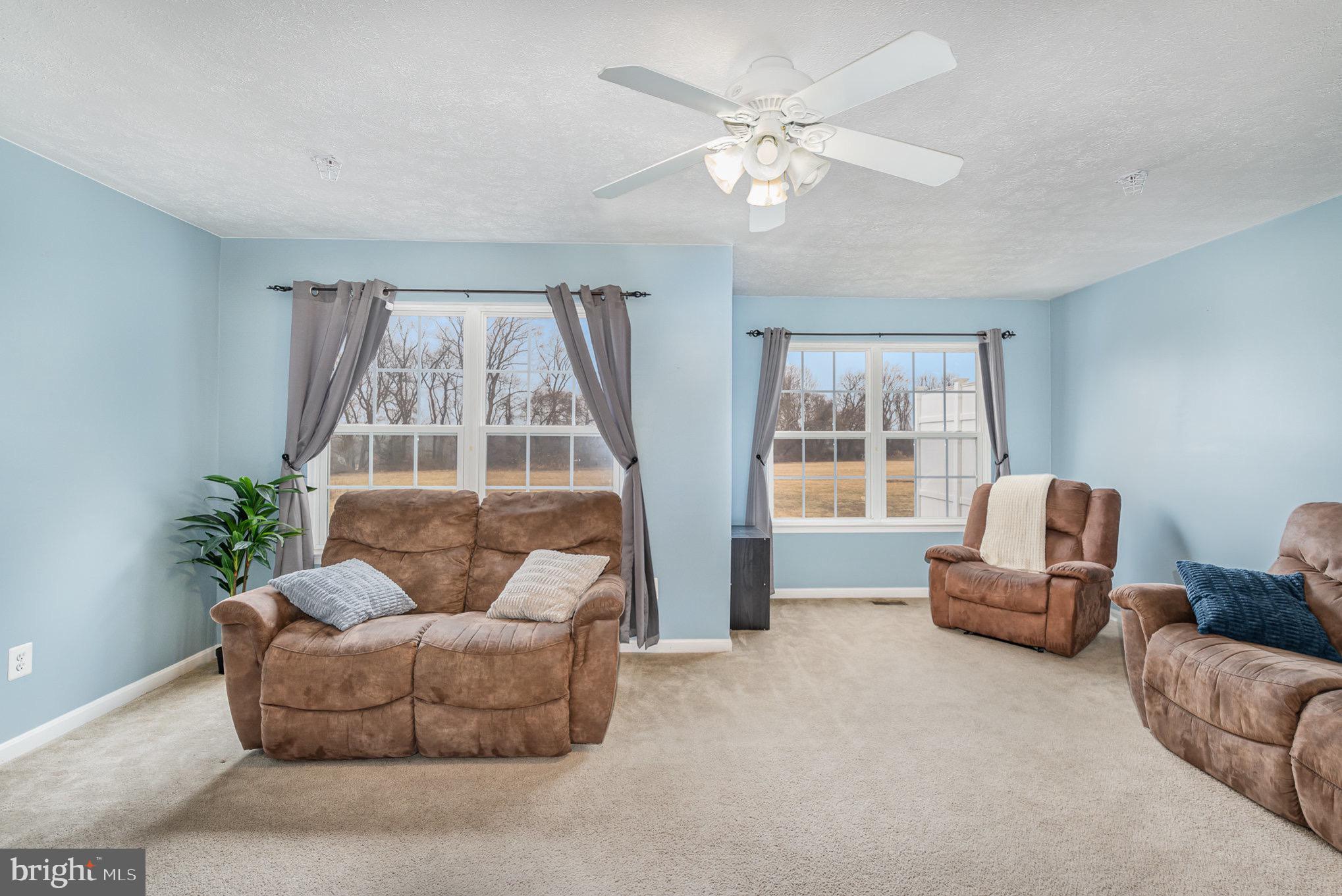 118 Maple Leaf Drive Rising Sun, MD 21911 - Photo 5 of 29 a living room with furniture and a large window