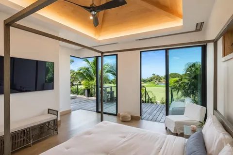 a bedroom with furniture and a potted plant