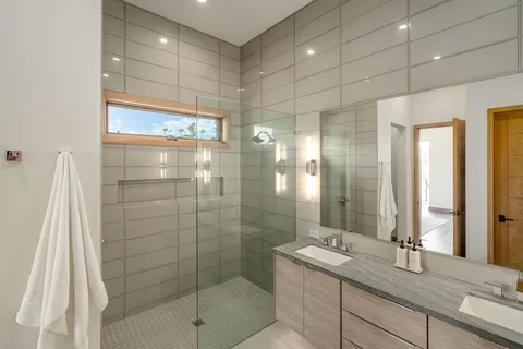 a bathroom with a shower and a sink