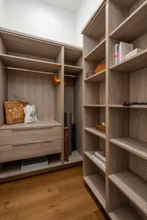 a view of an empty walk in closet