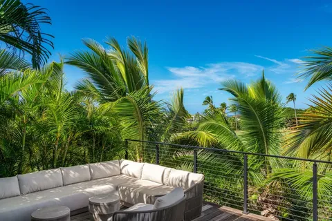 a green field with lots of trees in it
