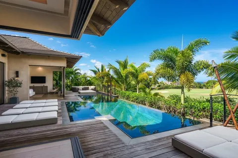 a view of a chairs and table in patio with wooden fence