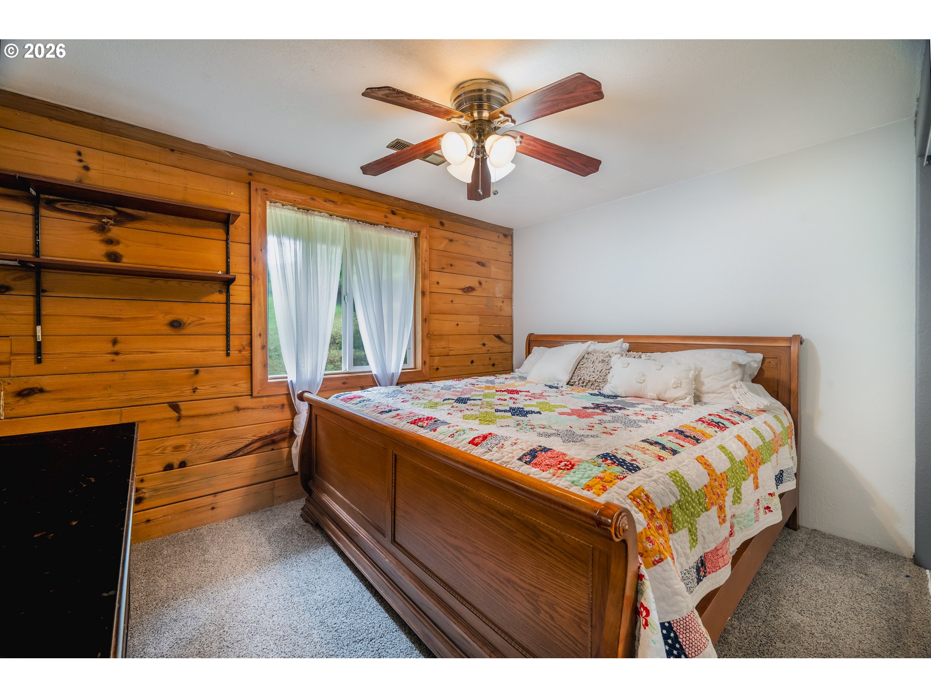 5278 Pearson Road Southeast Turner, OR 97392 - Photo 41 of 48 a bedroom with a bed and a chandelier