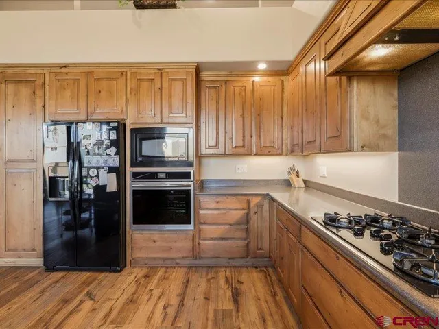 a kitchen with a refrigerator stove and a sink