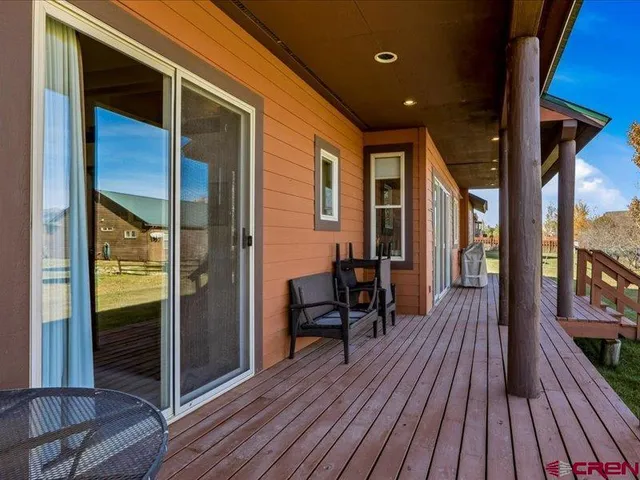 a balcony view with a glass door