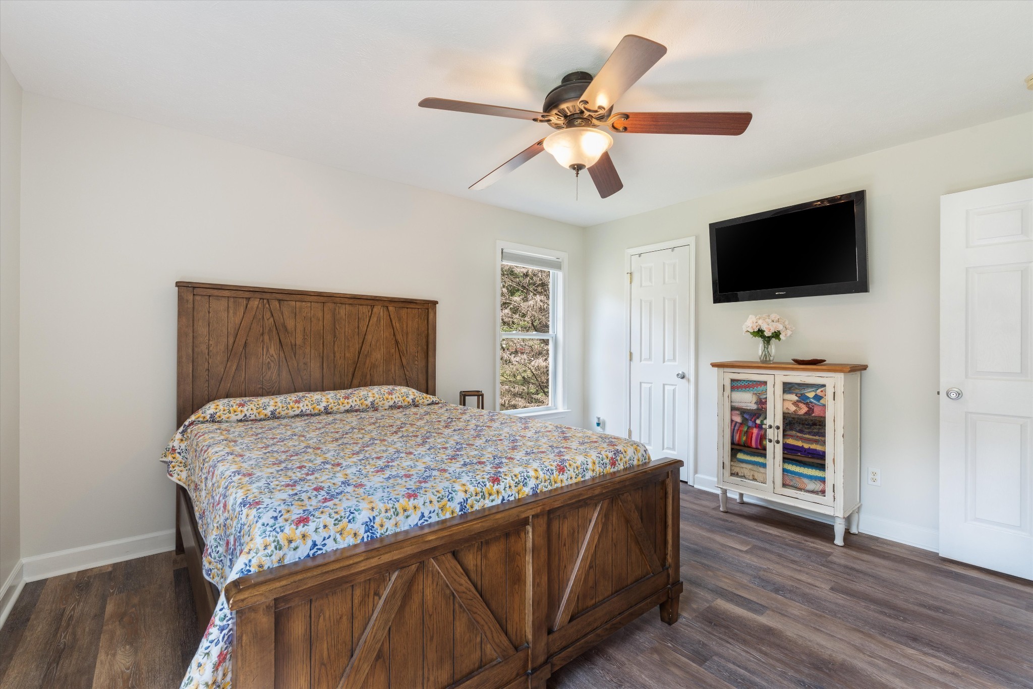 486 Sylvis Road Dickson, TN 37055 - Photo 12 of 24 a bedroom with a bed and a flat screen tv
