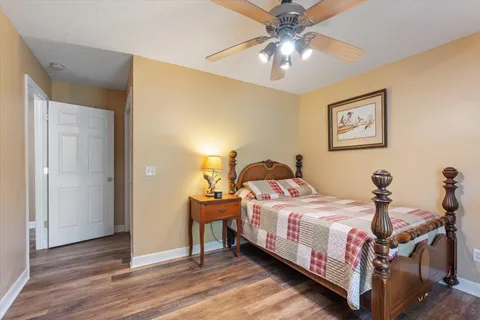 a bed room with a bed and a chandelier