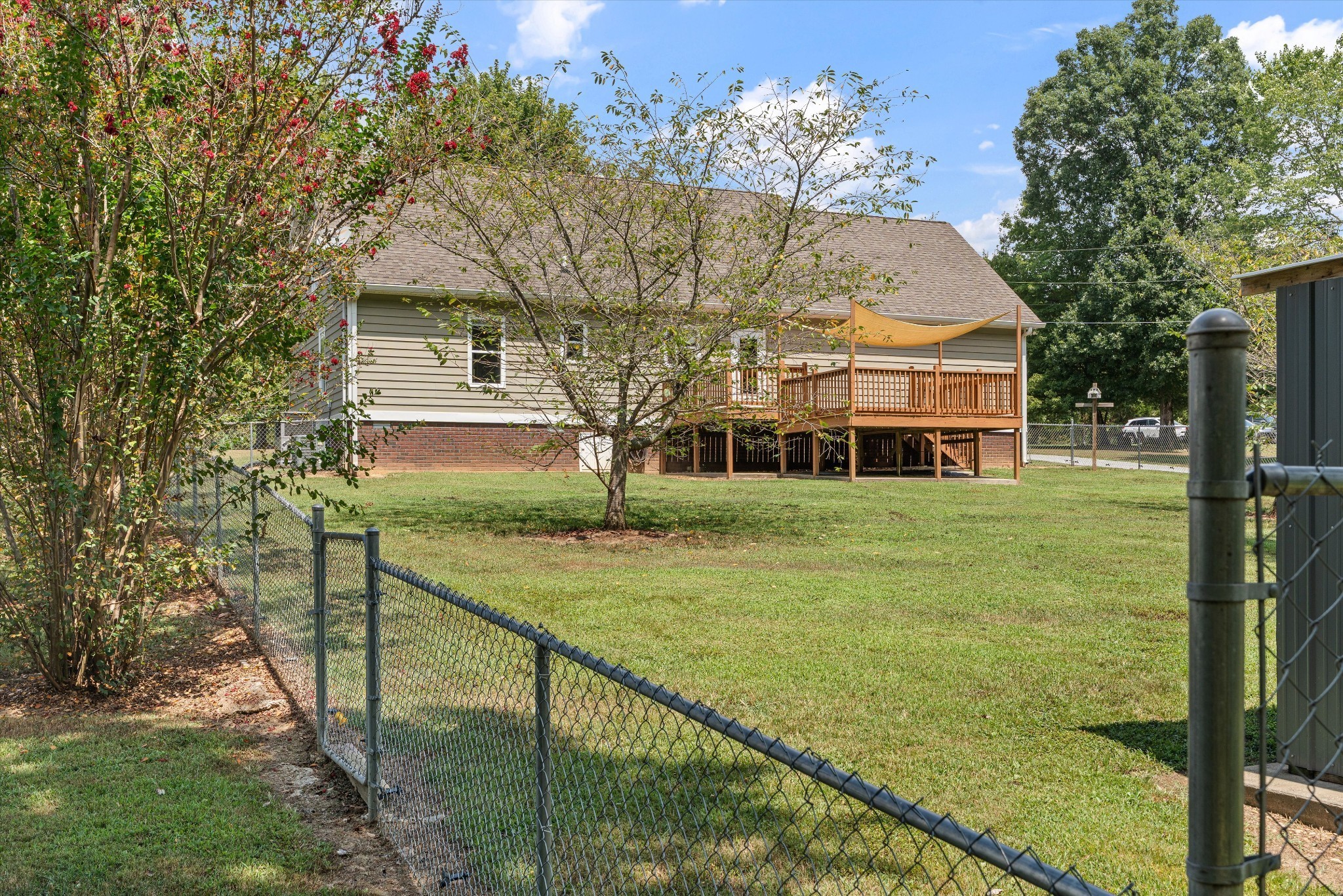 486 Sylvis Road Dickson, TN 37055 - Photo 24 of 24 a view of a house with backyard and tree