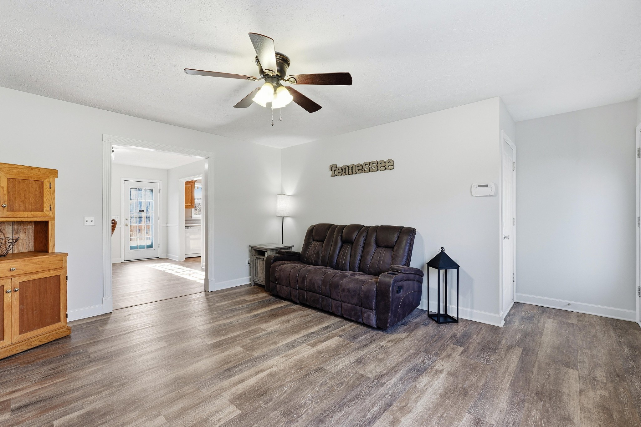 486 Sylvis Road Dickson, TN 37055 - Photo 6 of 24 a living room with couches and closet with wooden floor