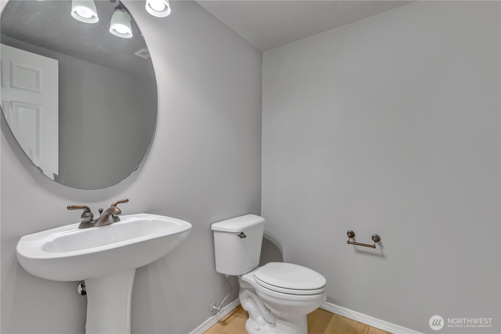 23516 Southeast 243rd Place Maple Valley, WA 98038 - Photo 15 of 31 a bathroom with a sink toilet and a mirror