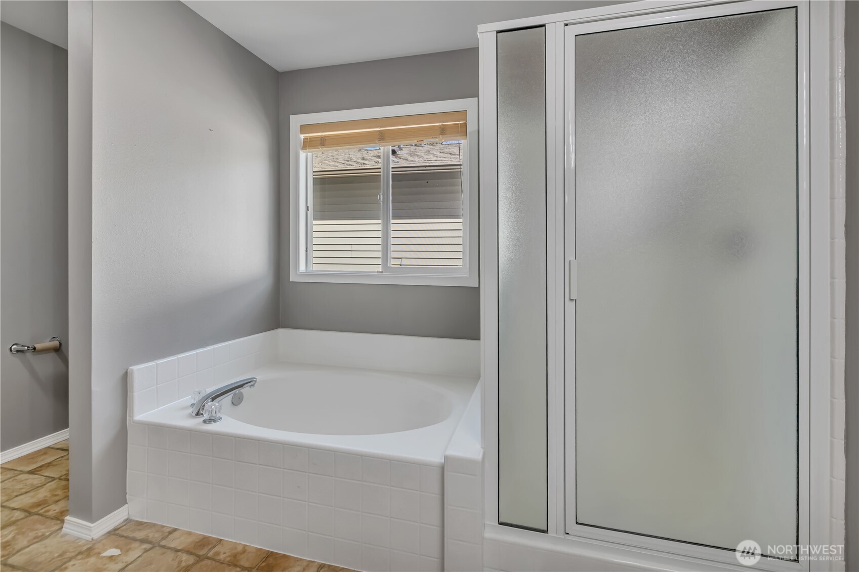 23516 Southeast 243rd Place Maple Valley, WA 98038 - Photo 24 of 33 a white bath tub sitting next to a window